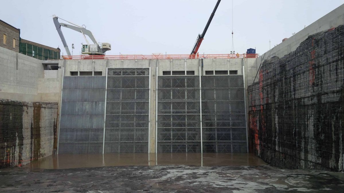 SAFE ZONE: The intake section for the new generating station at Chaudière Falls on the Ottawa River, with special tight-mesh "trash rack" to prevent downstream-bound migrating eels from being sucked into the turbines. On left wall, there are two bypass tubes that eels can enter to travel through the dam and be released below unharmed